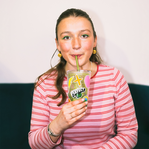 Romy drinking a matcha from the PerfectTed x Joe cup