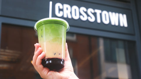 PB&J matcha latte being held up outside of crosstown