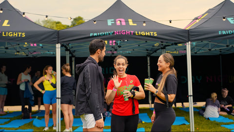 Runners smiling at friday nights run club event