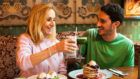 Tania and Teddie toasting during brunch