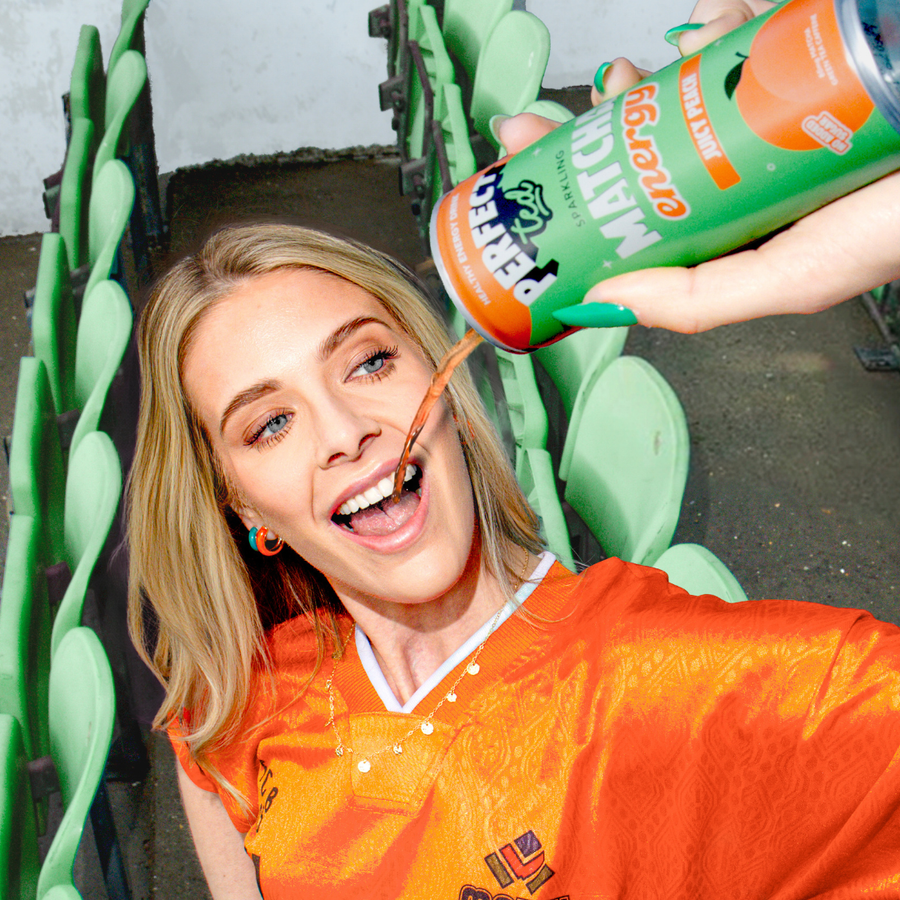 a woman in an orange shirt