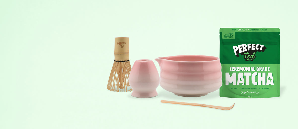 a pink bowl and a wooden whisk