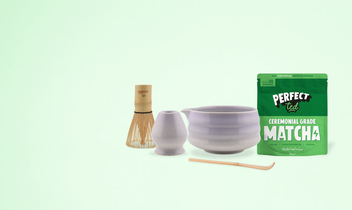 a bowl and a bowl with a wooden spoon and a bag of matcha powder