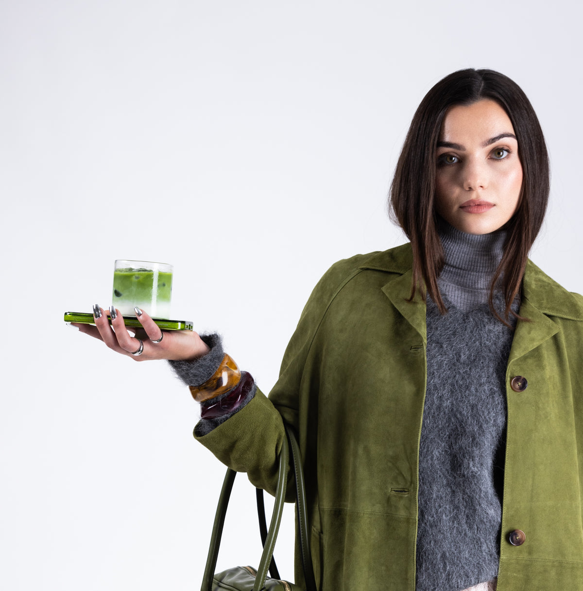 a woman holding a glass