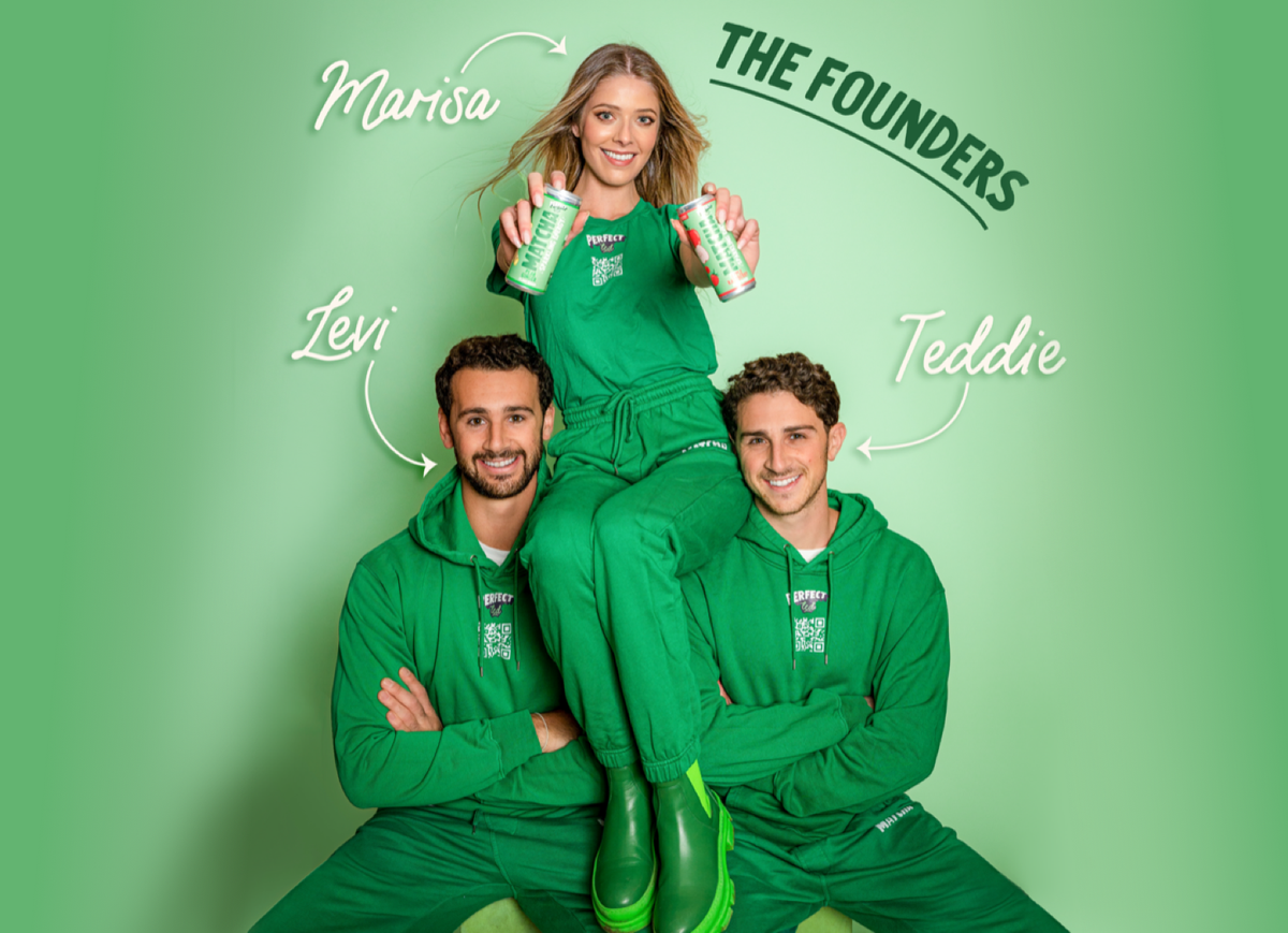 a group of people in green overalls posing for a photo